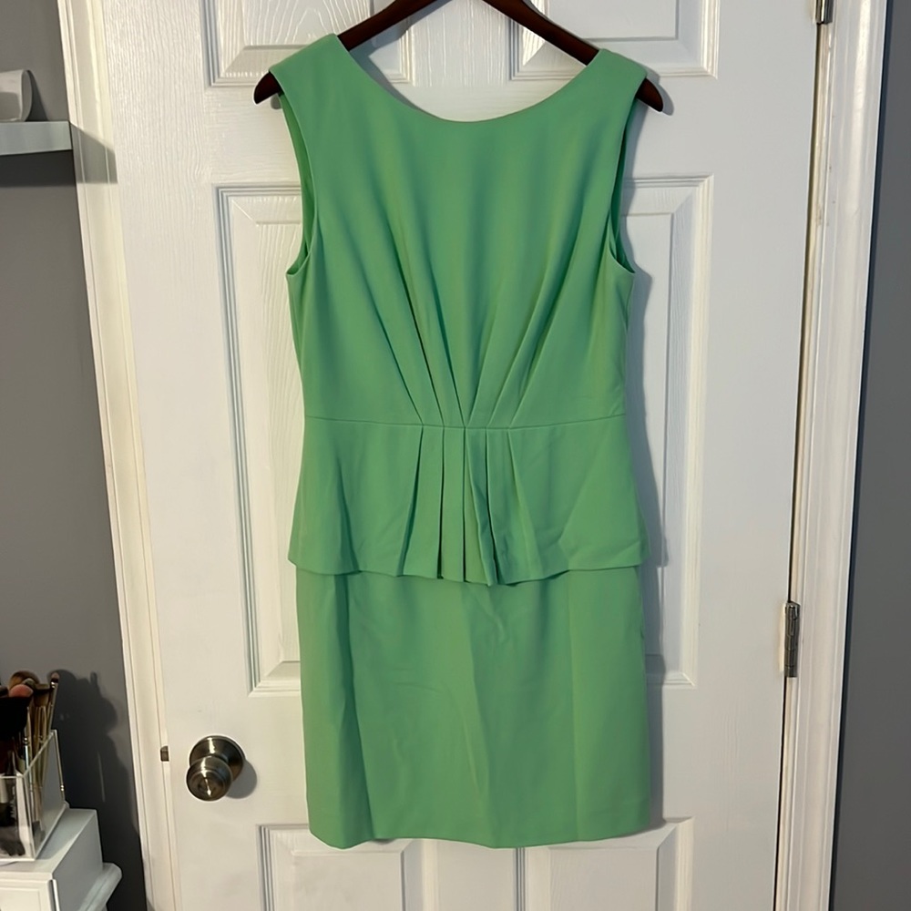 Mint green sleeveless dress with peplum detail